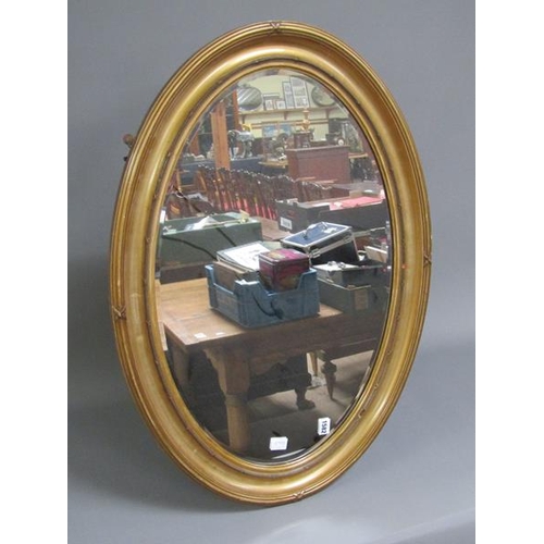 1582 - GILT WOOD OVAL FRAMED WALL MIRROR, 87CM W