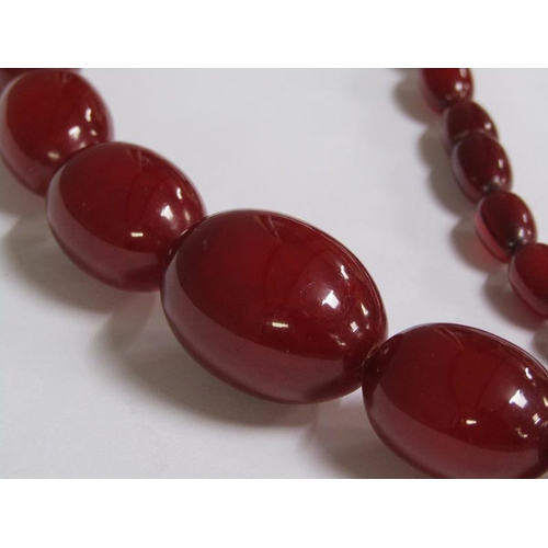 1237 - STRING OF CHERRY AMBER GRADUATED BEADS, 61G, 75CM L