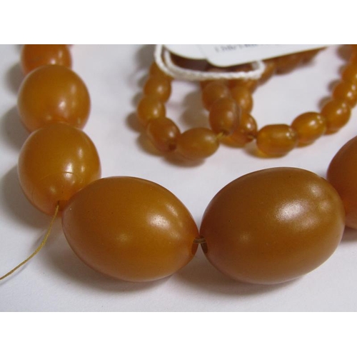 1238 - STRING OF AMBER TYPE BEADS, 67G, 92CM L