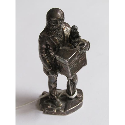 1242 - SILVER PLATED FIGURE OF A HURDYGURDY MAN, 10CM H