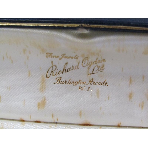 100 - A string of cultured pearls, 55cm l, with gold stone set clasp.