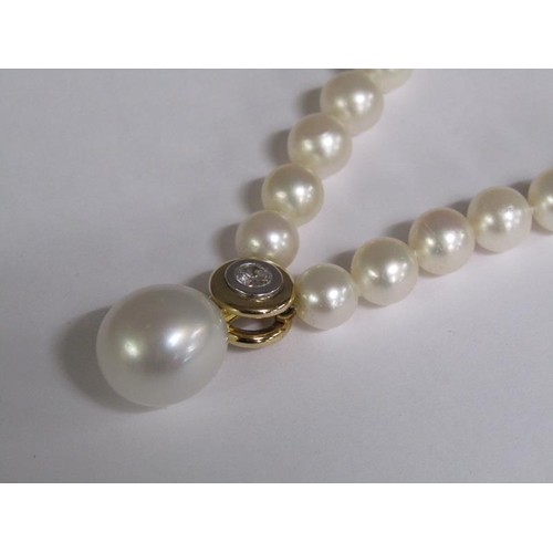 101 - A cultured pearl and diamond necklace with twenty four akoya cultured pearls, 18ct gold clasps set w... 