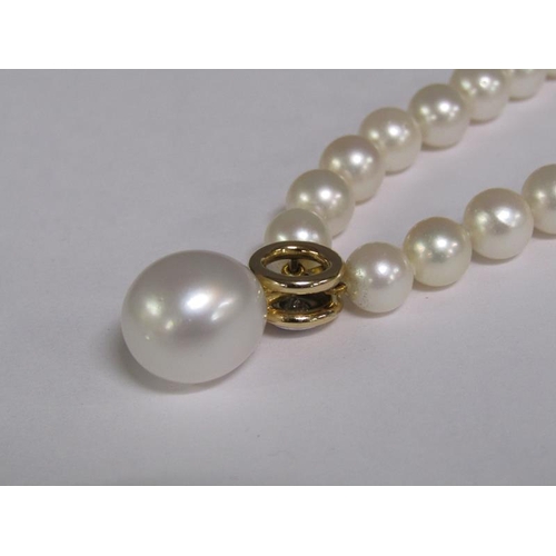 101 - A cultured pearl and diamond necklace with twenty four akoya cultured pearls, 18ct gold clasps set w... 