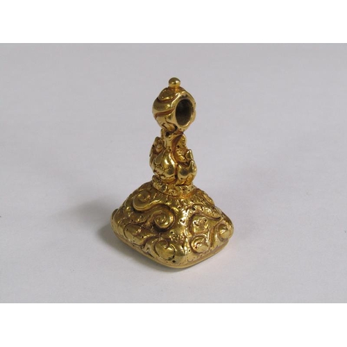 104 - A gold metal seal fob with engraved thistle seal, 4.5cm l.