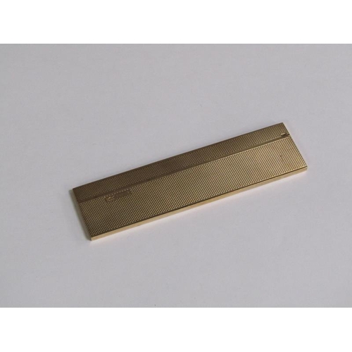 105 - A 9ct gold engine turned cased comb, makers marks S J R, Birmingham 1977, 36.6g total.