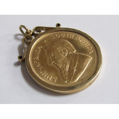 107 - A 1974 Krugerrand in a 9ct gold mount.
