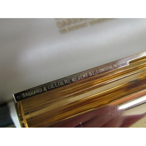 108 - A 1961 9ct gold and sapphire cylindrical box by Kurk Weiss for Garrard & Co, 62.8g, 7.5cm w.