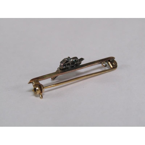 112 - A 9ct gold diamond set insect bar brooch, 2.6g.
