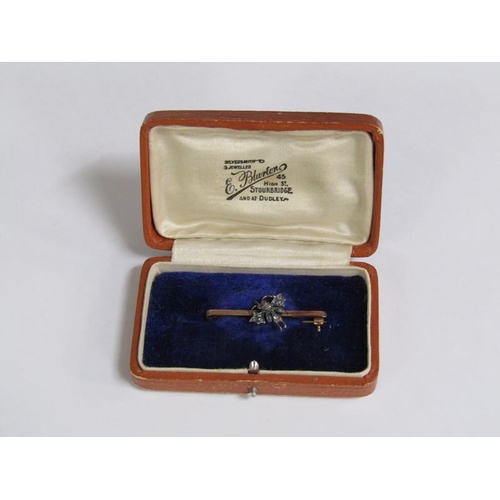 112 - A 9ct gold diamond set insect bar brooch, 2.6g.