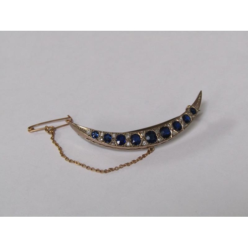 114 - A gold sapphire and diamond set crescent brooch, 5.25cm l.