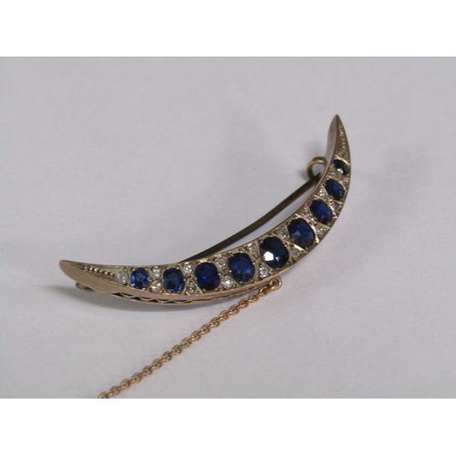 114 - A gold sapphire and diamond set crescent brooch, 5.25cm l.