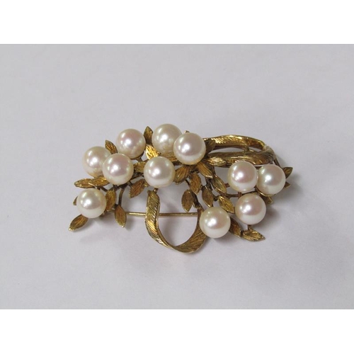 115 - A 14ct gold scrolling floral brooch, pearl set.