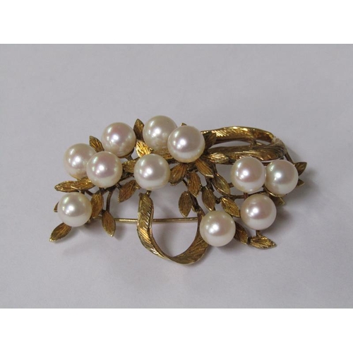115 - A 14ct gold scrolling floral brooch, pearl set.
