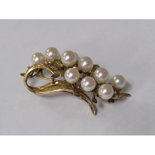 115 - A 14ct gold scrolling floral brooch, pearl set.