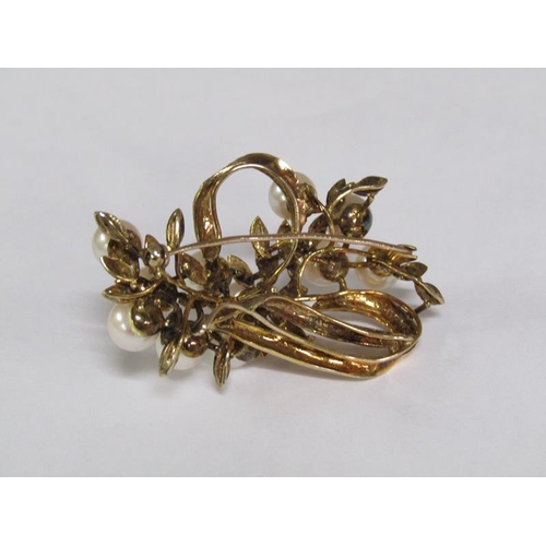 115 - A 14ct gold scrolling floral brooch, pearl set.