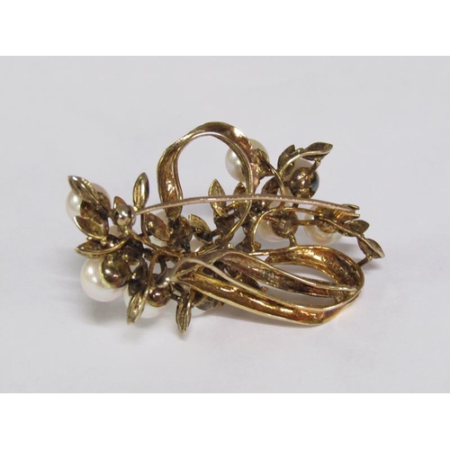 115 - A 14ct gold scrolling floral brooch, pearl set.