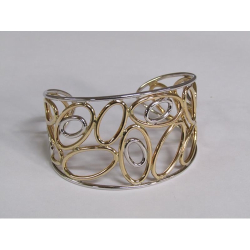 119 - A 9ct two colour gold open bracelet, 11.8g.