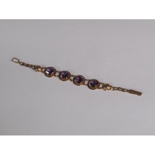 120 - An Egyptian gold bracelet set with four cut amethysts, total 18.4g, 18.5cm l.
