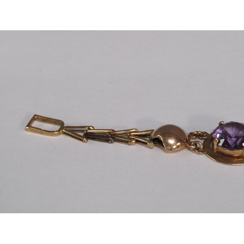 120 - An Egyptian gold bracelet set with four cut amethysts, total 18.4g, 18.5cm l.