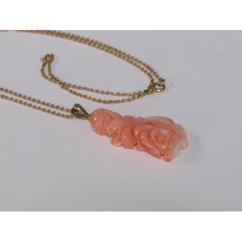 124 - A 14ct gold ring set with rose carved coral setting, size M 1/2, together with a 14ct gold chain wit... 