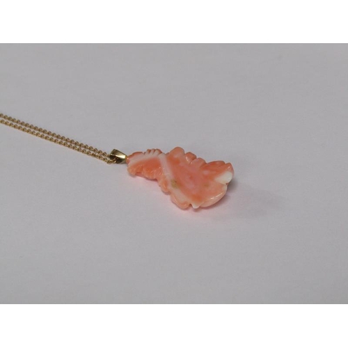 124 - A 14ct gold ring set with rose carved coral setting, size M 1/2, together with a 14ct gold chain wit... 