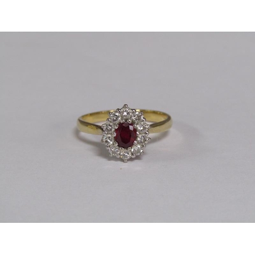 131 - An 18ct gold ruby and diamond set ring, size R.