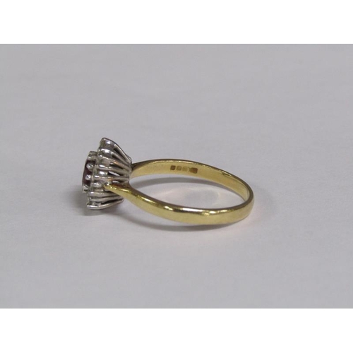 131 - An 18ct gold ruby and diamond set ring, size R.