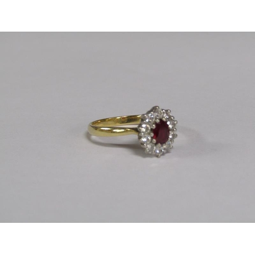 131 - An 18ct gold ruby and diamond set ring, size R.