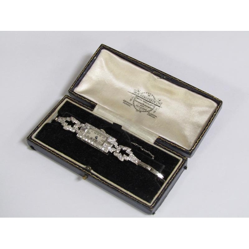 99 - An Art Deco platinum and diamond set ladies cocktail watch, 14.1g overall.