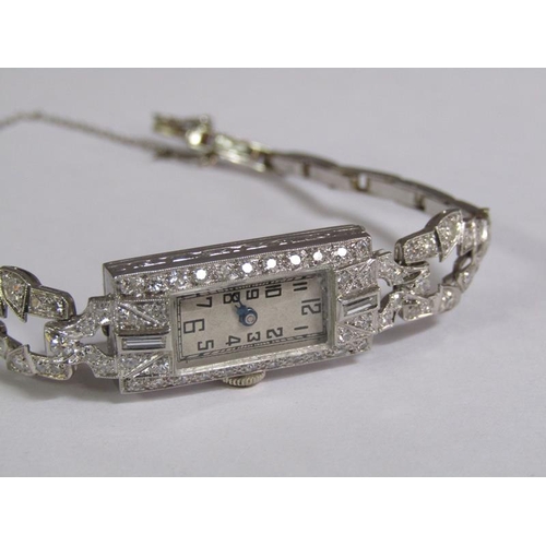 99 - An Art Deco platinum and diamond set ladies cocktail watch, 14.1g overall.