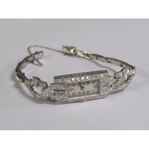99 - An Art Deco platinum and diamond set ladies cocktail watch, 14.1g overall.