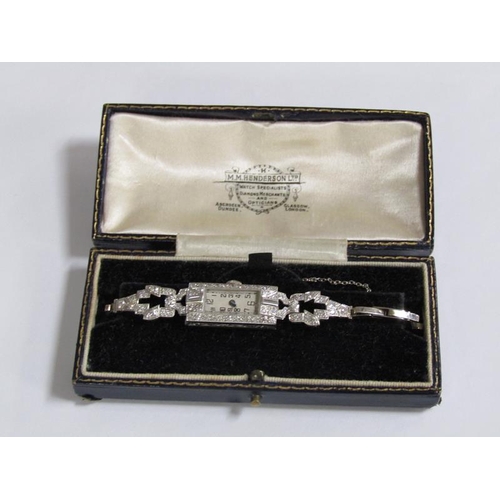 99 - An Art Deco platinum and diamond set ladies cocktail watch, 14.1g overall.