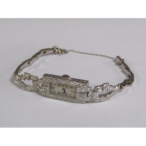 99 - An Art Deco platinum and diamond set ladies cocktail watch, 14.1g overall.