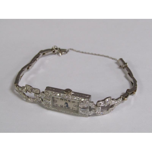 99 - An Art Deco platinum and diamond set ladies cocktail watch, 14.1g overall.