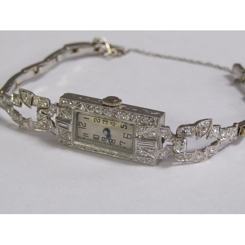 99 - An Art Deco platinum and diamond set ladies cocktail watch, 14.1g overall.