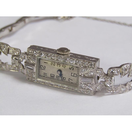 99 - An Art Deco platinum and diamond set ladies cocktail watch, 14.1g overall.