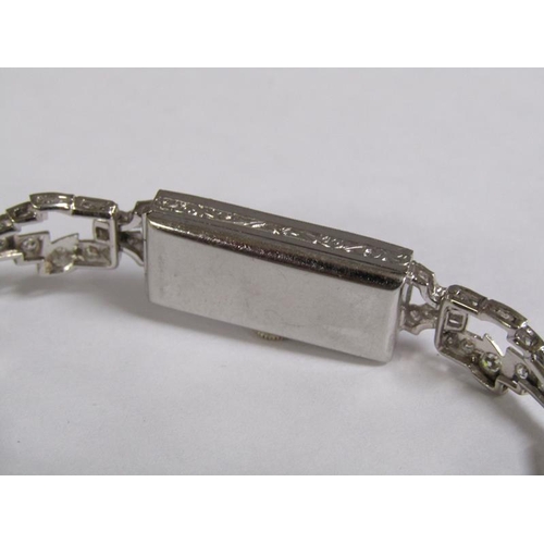 99 - An Art Deco platinum and diamond set ladies cocktail watch, 14.1g overall.