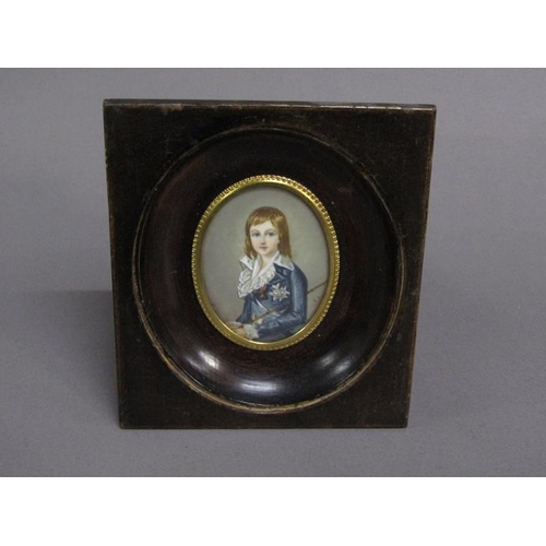 83 - Portrait of a young boy in early 19c costume holding a cane, signed in mono, oval framed and glazed,... 