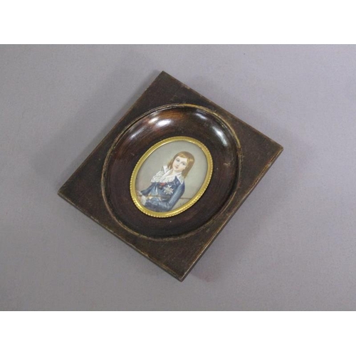 83 - Portrait of a young boy in early 19c costume holding a cane, signed in mono, oval framed and glazed,... 