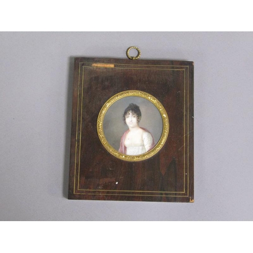 85 - Unsigned - A mid 19c portrait of a lady, circular framed and glazed, 7cm diam.