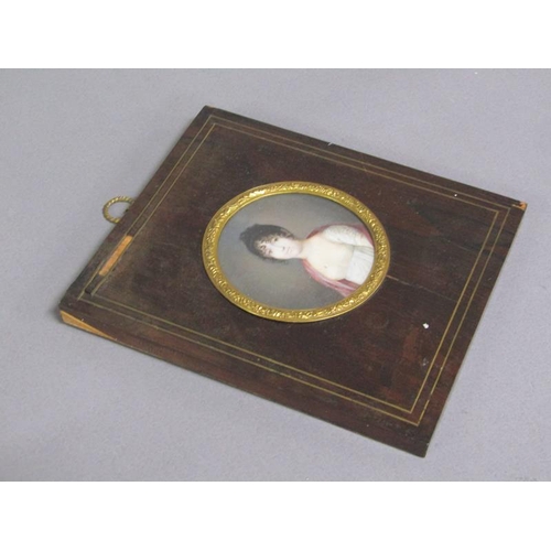 85 - Unsigned - A mid 19c portrait of a lady, circular framed and glazed, 7cm diam.