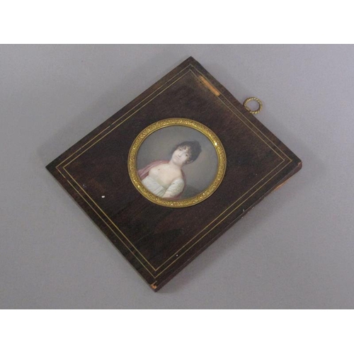 85 - Unsigned - A mid 19c portrait of a lady, circular framed and glazed, 7cm diam.