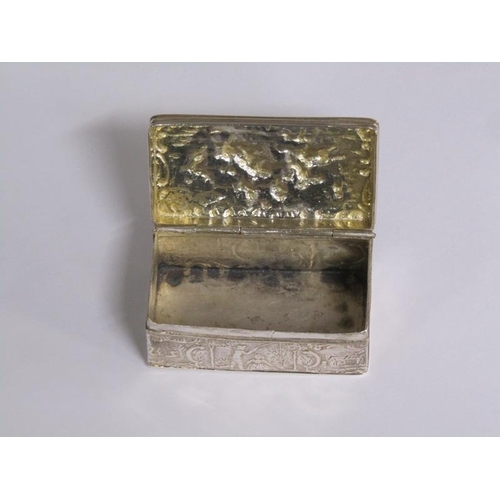 161 - A late Victorian snuff box, embossed with village scenes and the lid with the scene of two soldiers ... 