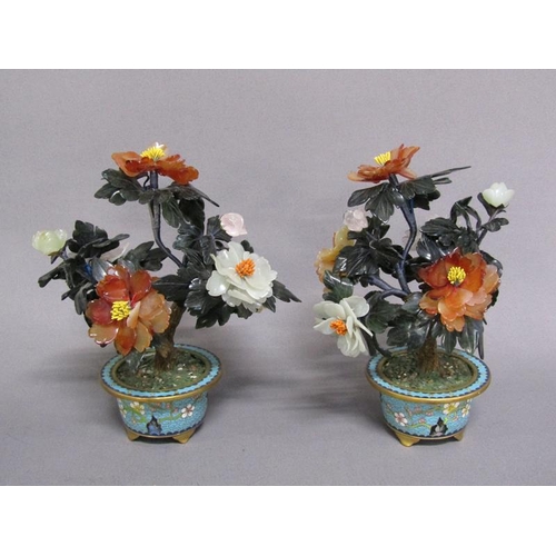 81 - A pair of Oriental stone and cloisonne peony trees, the leaves carved with Chinese jade, rose quartz... 