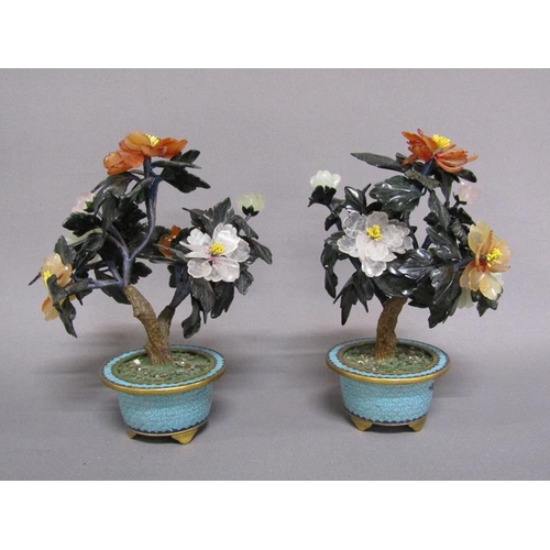 81 - A pair of Oriental stone and cloisonne peony trees, the leaves carved with Chinese jade, rose quartz... 