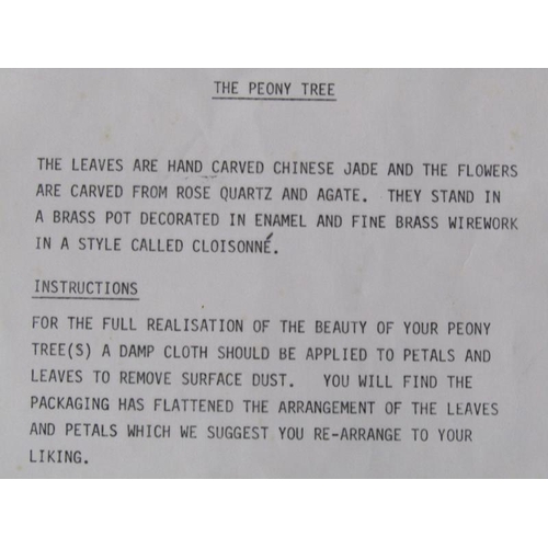 81 - A pair of Oriental stone and cloisonne peony trees, the leaves carved with Chinese jade, rose quartz... 