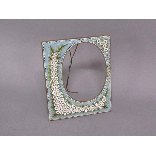 61 - An early 20c brass easel frame decorated with daisy and blue ground micro mosaic borders, 20cm w, 16... 