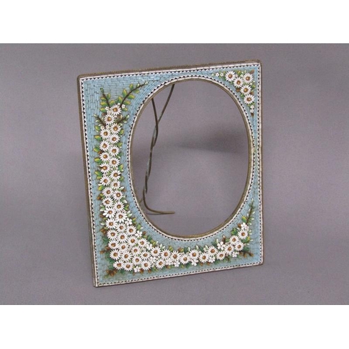 61 - An early 20c brass easel frame decorated with daisy and blue ground micro mosaic borders, 20cm w, 16... 