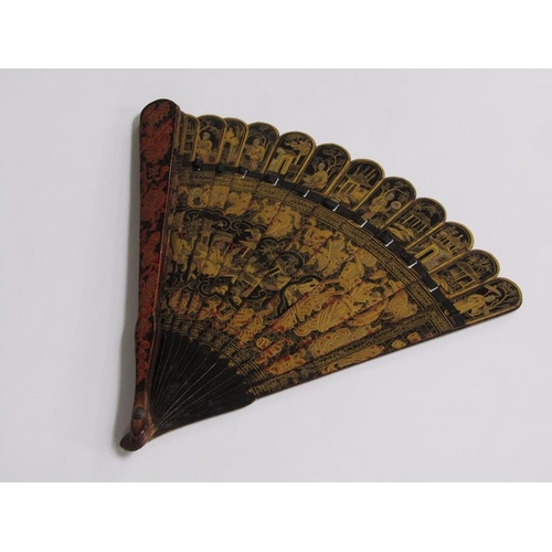 62 - A Japanese Meiji period tortoiseshell fan, chinoiserie decorated with figures, buildings and foliate... 