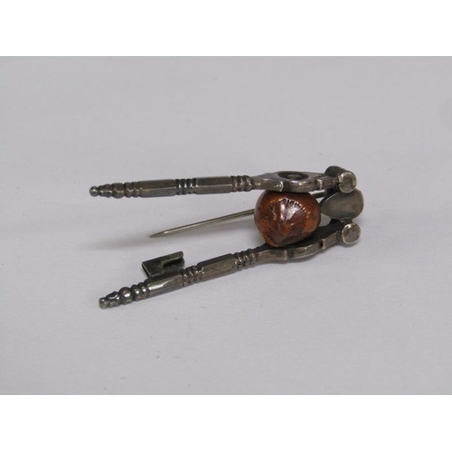 65 - A pair of Victorian miniature steel nut crack brooch, registration number for 1885, 4.5cm l.
